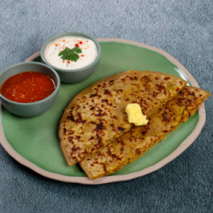 Paneer paratha with curd and sauce